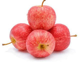 A 1kg bag with several Royal Gala apples showing their characteristic red-orange blush over yellow skin.